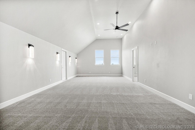 unfurnished living room with lofted ceiling, ceiling fan, and light carpet