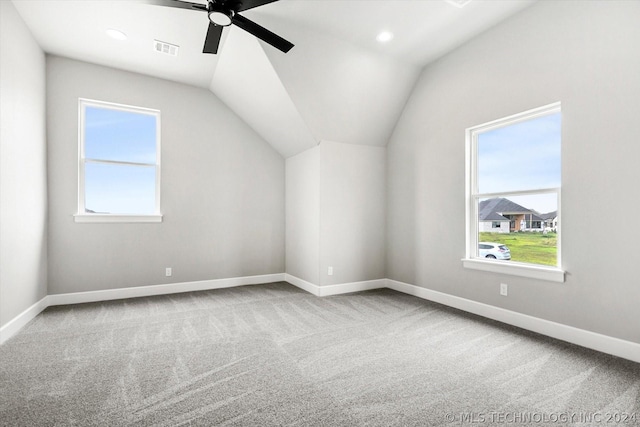 bonus room with baseboards, visible vents, a ceiling fan, vaulted ceiling, and carpet flooring