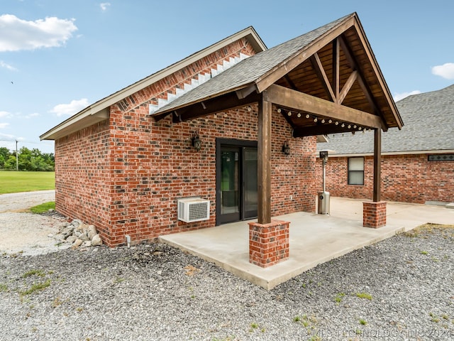 rear view of property featuring a patio area