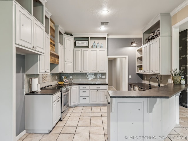 kitchen with white cabinetry, ornamental molding, kitchen peninsula, and stainless steel range with electric stovetop