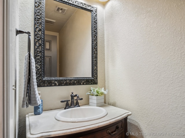 8213 9th St, Beggs, OK 74421 - bathroom featuring vanity and a textured wall