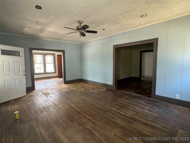 empty room featuring hardwood / wood-style flooring and ceiling fan