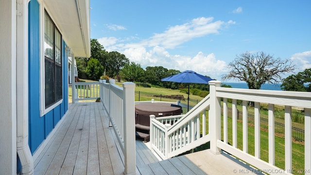 deck featuring a hot tub