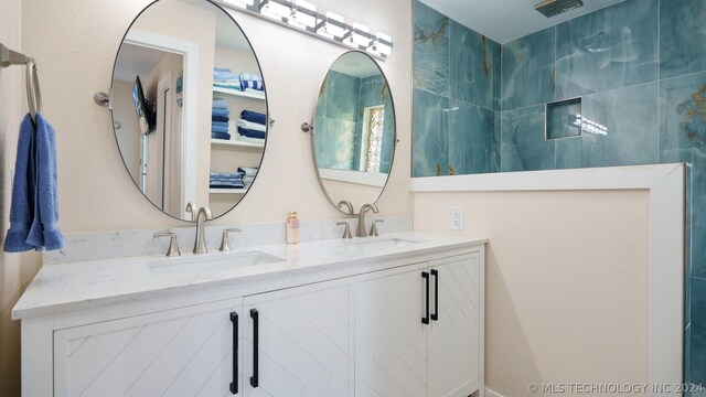 bathroom featuring dual bowl vanity