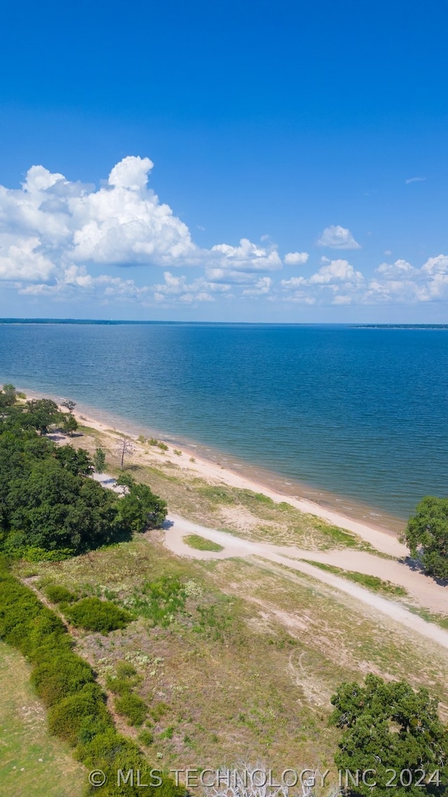 property view of water featuring a beach view