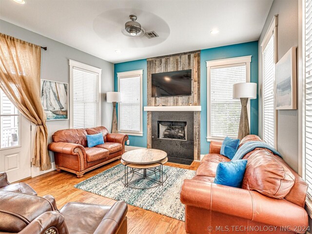 39 Boardwalk St, Carlton Landing, OK 74432 - living room with a fireplace, ceiling fan, and wood-type flooring
