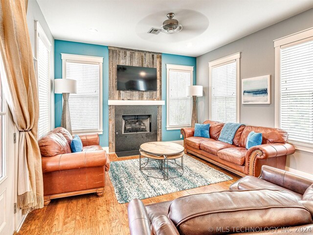 39 Boardwalk St, Carlton Landing, OK 74432 - living room featuring a fireplace, light hardwood / wood-style floors, and plenty of natural light
