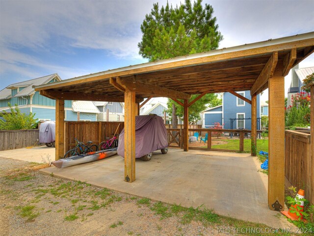 39 Boardwalk St, Carlton Landing, OK 74432 - view of patio / terrace featuring an outbuilding and a grill