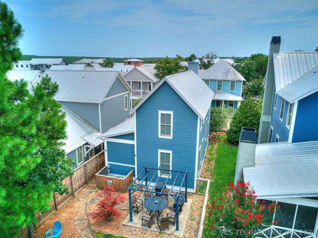 39 Boardwalk St, Carlton Landing, OK 74432 - back of house featuring a patio