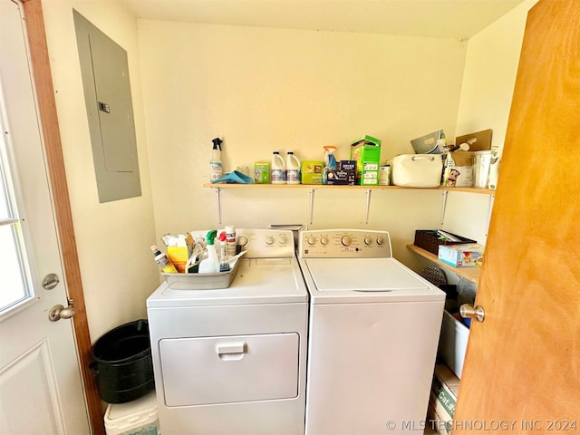 laundry room with washer and clothes dryer and electric panel