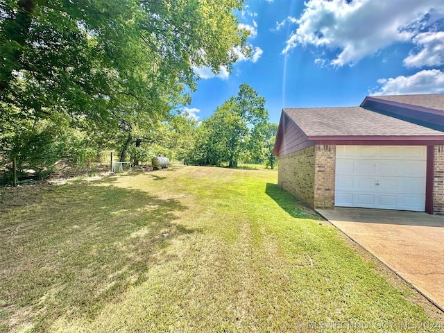 view of yard with a garage