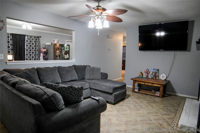 tiled living room with ceiling fan