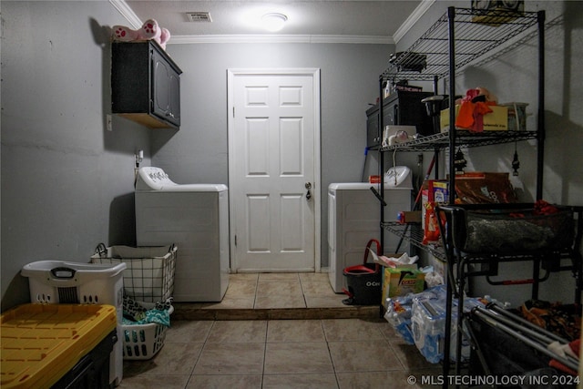 laundry room with crown molding, cabinets, and tile patterned floors