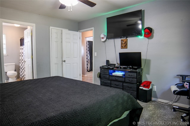 bedroom with carpet flooring, connected bathroom, and ceiling fan