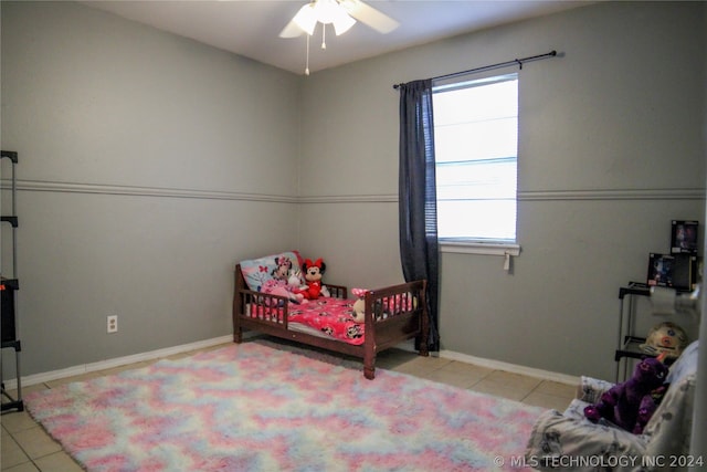 bedroom with light tile patterned floors and ceiling fan