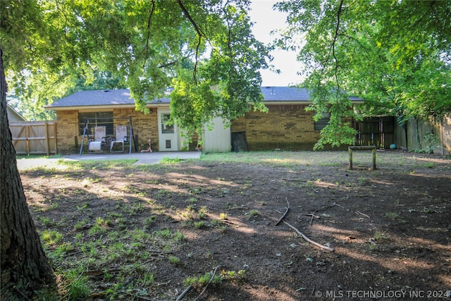 rear view of house featuring a patio area