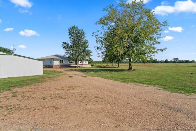 view of yard with a rural view