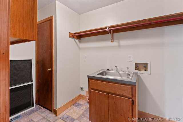 clothes washing area with washer hookup, electric dryer hookup, and sink