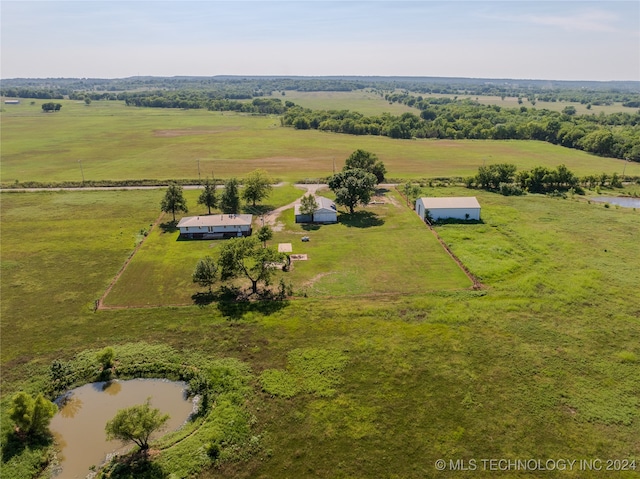 birds eye view of property with a rural view and a water view