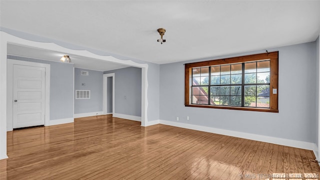 unfurnished room featuring wood-type flooring