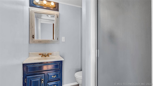 bathroom with a shower, toilet, and vanity