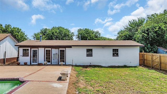 ranch-style house with a patio area, a fenced in pool, and a front yard