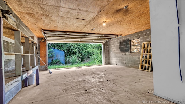 garage featuring wooden ceiling and french doors