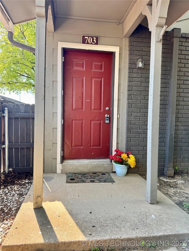 9031 S Delaware Ave Unit 703, Tulsa, OK 74137 - entrance to property with fence and brick siding