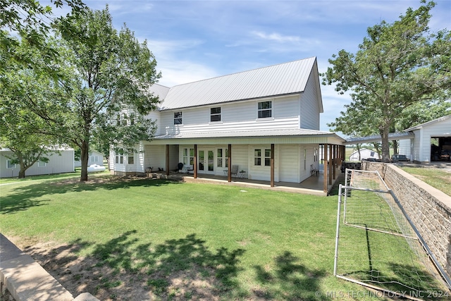 back of house with a yard and covered porch