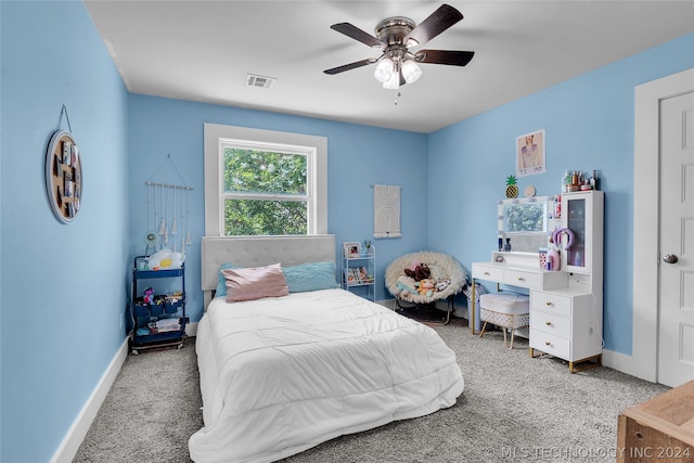 bedroom with light carpet and ceiling fan