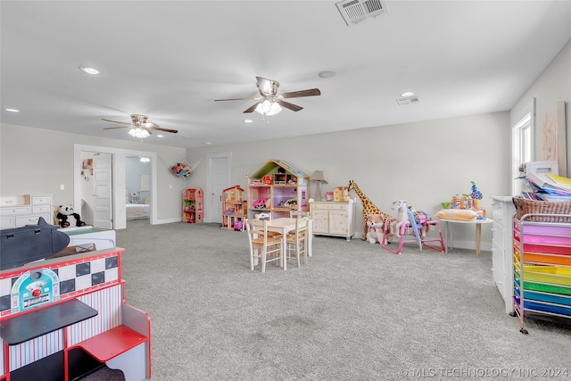 playroom featuring light carpet and ceiling fan