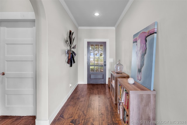 foyer entrance featuring crown molding and dark hardwood / wood-style floors