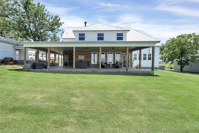 back of house with a patio area, a yard, and ceiling fan