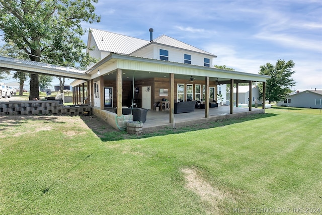 back of property featuring a patio, an outdoor hangout area, a lawn, and ceiling fan