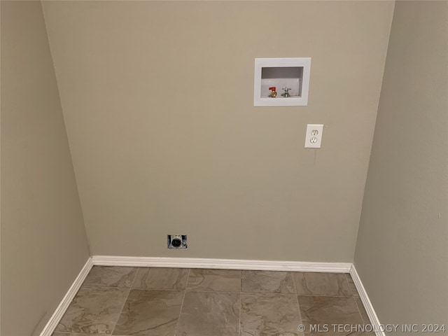 laundry area with hookup for an electric dryer, tile patterned flooring, and hookup for a washing machine