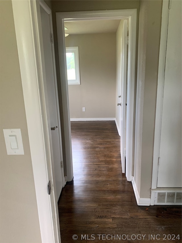 hallway featuring dark hardwood / wood-style flooring