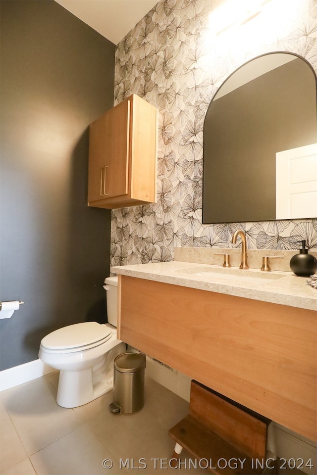 bathroom with tile patterned floors, toilet, and vanity