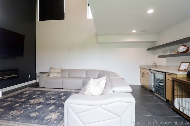 tiled living room featuring sink and wine cooler