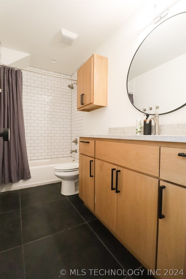 full bathroom with tile patterned floors, vanity, shower / tub combo, and toilet