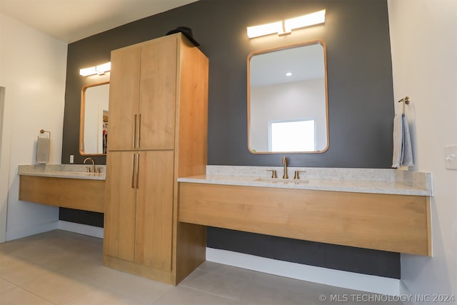 bathroom with vanity and tile patterned flooring