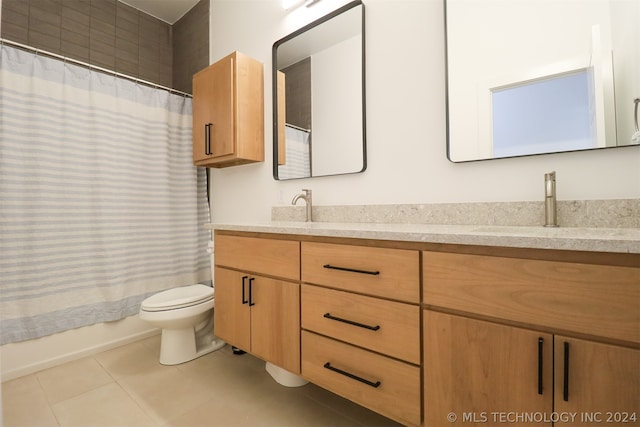 full bathroom with shower / tub combo with curtain, dual bowl vanity, toilet, and tile patterned floors