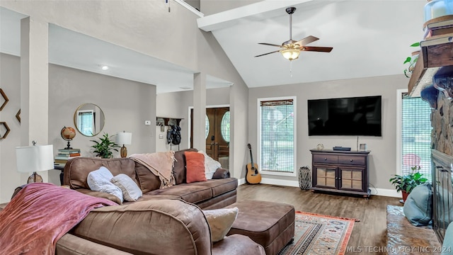 living room featuring french doors, a fireplace, ceiling fan, dark hardwood / wood-style floors, and high vaulted ceiling