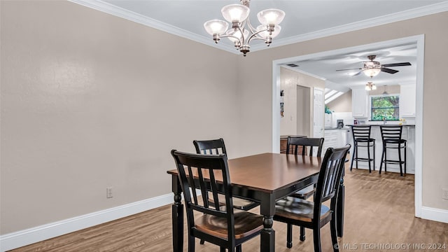 dining room featuring light hardwood / wood-style floors, ceiling fan with notable chandelier, and ornamental molding