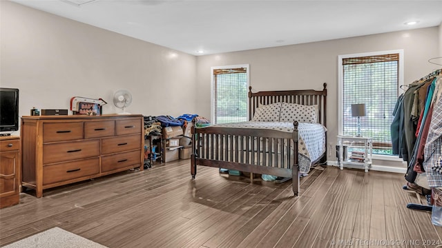 bedroom with wood-type flooring