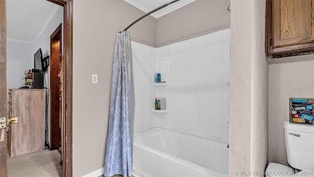 bathroom with toilet, ornamental molding, and shower / bath combo