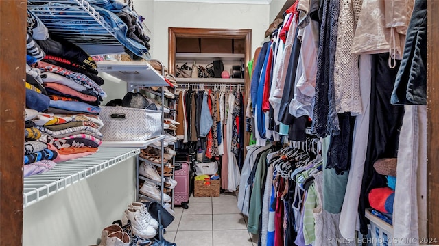 spacious closet featuring light tile patterned floors