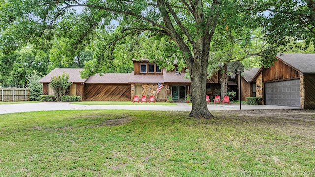 view of front of home with a garage and a front yard