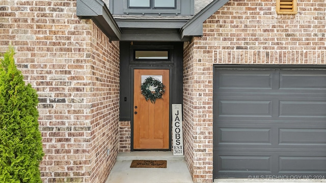 property entrance with a garage