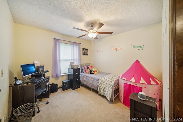 carpeted bedroom featuring a textured ceiling and ceiling fan