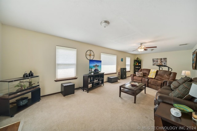 carpeted living room featuring a healthy amount of sunlight and ceiling fan